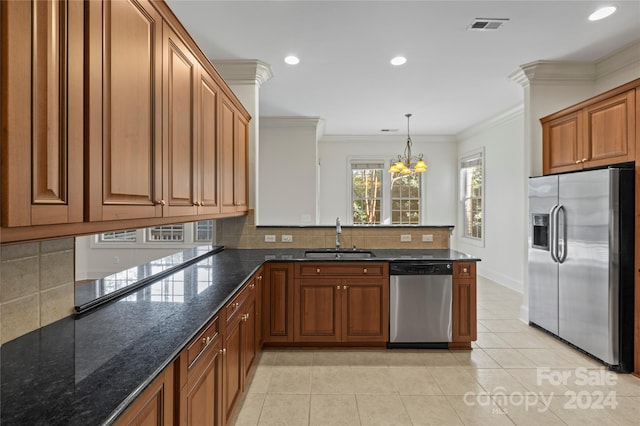 kitchen with light tile patterned flooring, sink, appliances with stainless steel finishes, and a chandelier