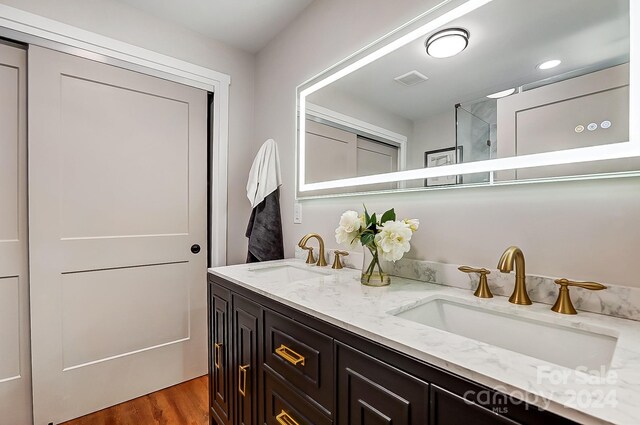 bathroom featuring vanity and hardwood / wood-style flooring