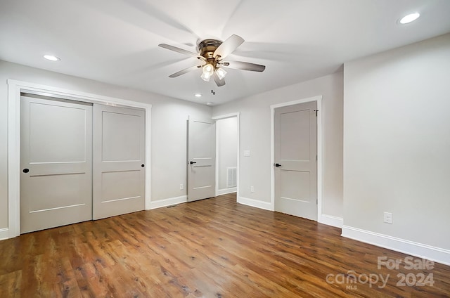 unfurnished bedroom featuring ceiling fan and hardwood / wood-style flooring