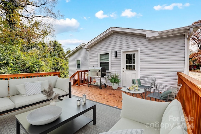 deck with outdoor lounge area and grilling area