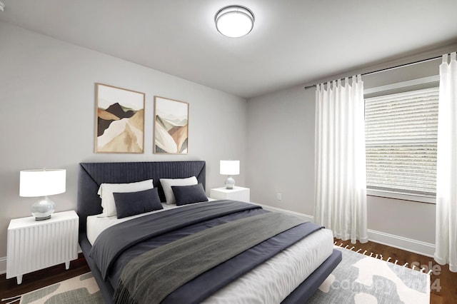 bedroom featuring dark hardwood / wood-style flooring