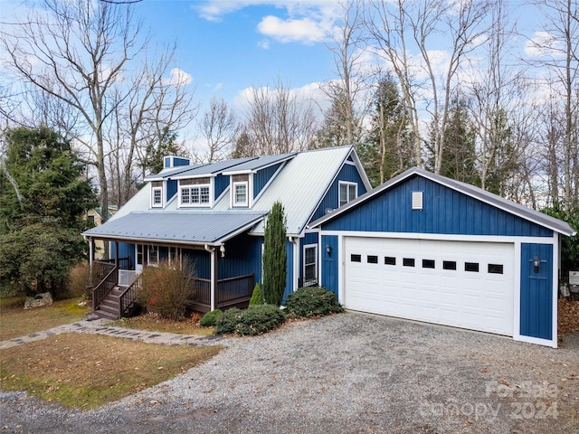 view of front of house with a porch and a garage