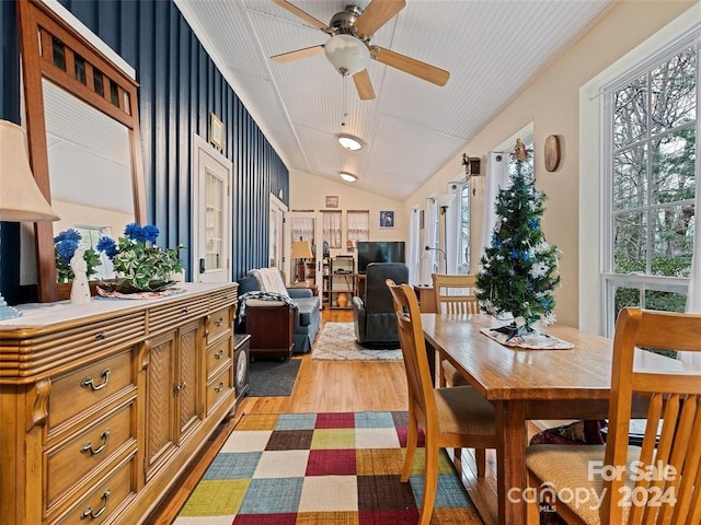 dining room featuring ceiling fan, light hardwood / wood-style floors, and lofted ceiling