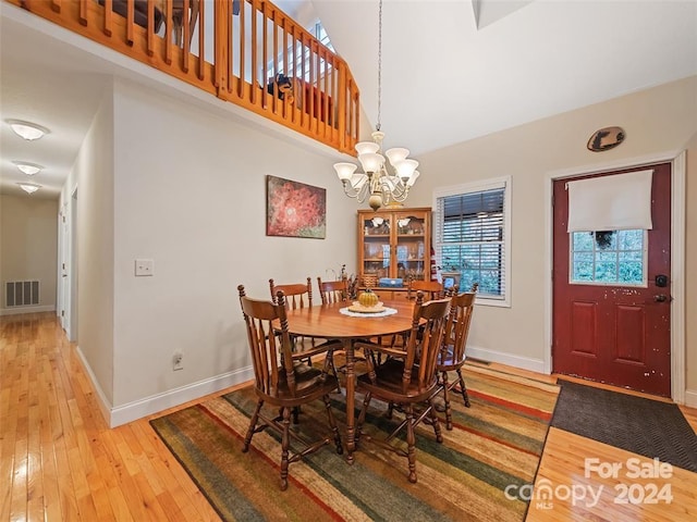 dining area featuring a chandelier and hardwood / wood-style floors