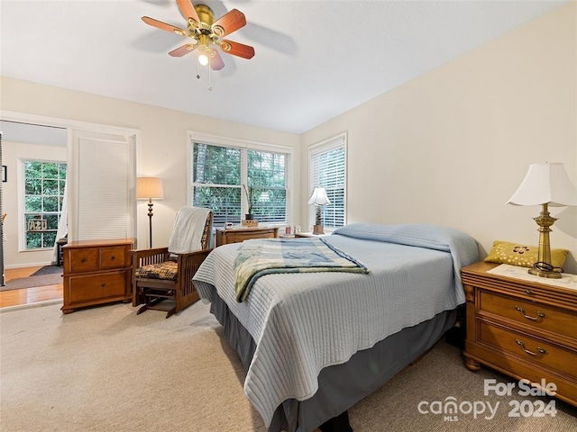 carpeted bedroom featuring ceiling fan