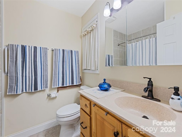 bathroom with tile patterned flooring, vanity, toilet, and a shower with shower curtain