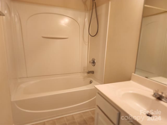 bathroom featuring vanity and washtub / shower combination