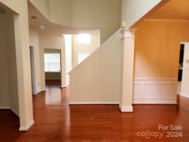 stairway with hardwood / wood-style flooring