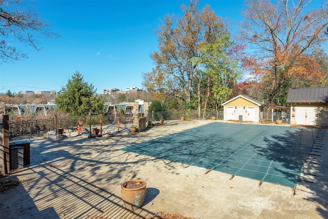 view of swimming pool featuring a storage unit and a patio area