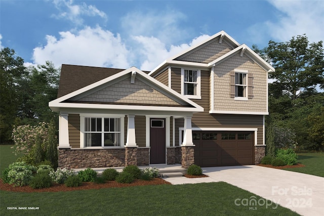 craftsman house featuring a front yard and a garage