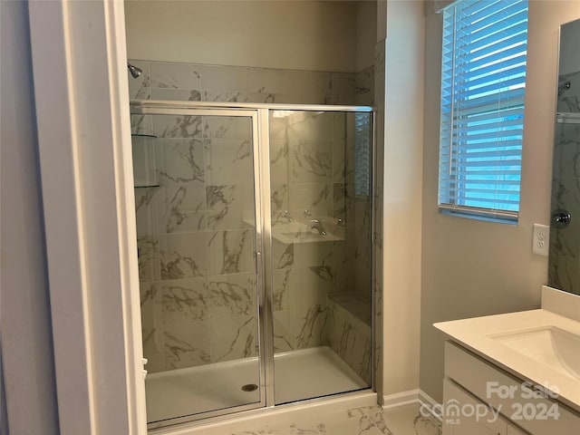 bathroom with vanity and walk in shower