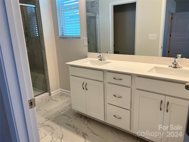 bathroom featuring vanity and a shower with door