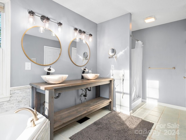 bathroom with vanity, separate shower and tub, and tile patterned floors