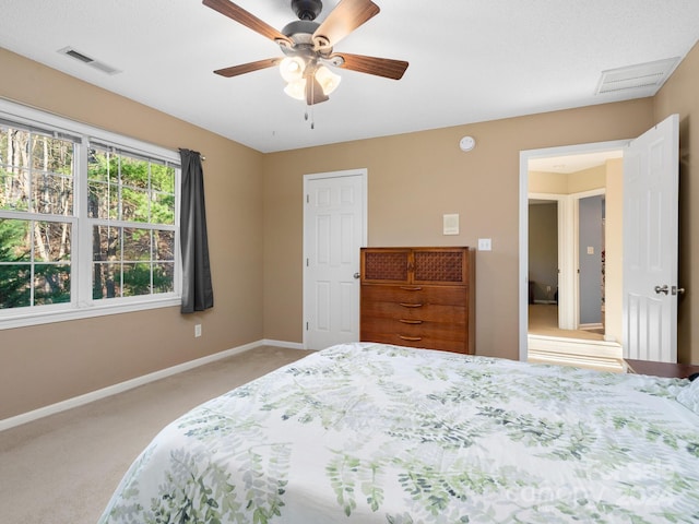 bedroom with light colored carpet and ceiling fan