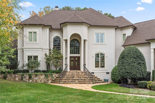 view of front of property with french doors and a front yard