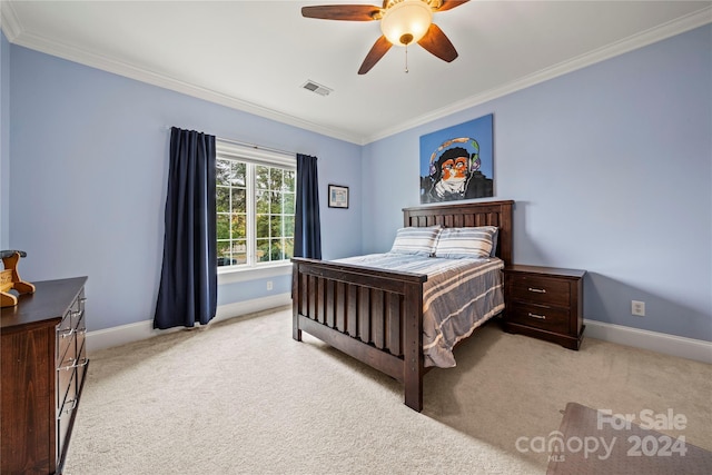 bedroom with ceiling fan, light colored carpet, and ornamental molding