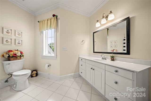 bathroom featuring tile patterned flooring, vanity, toilet, and crown molding