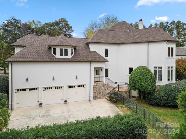 view of side of home featuring a garage