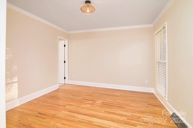 unfurnished bedroom featuring ornamental molding and hardwood / wood-style floors