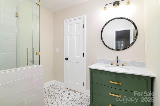 bathroom featuring walk in shower, vanity, and tile patterned flooring