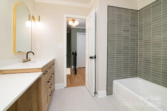 bathroom with vanity, tile patterned flooring, tiled shower / bath combo, and ornamental molding