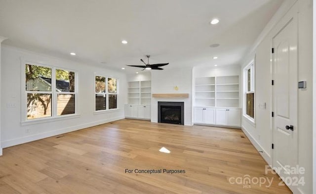 unfurnished living room with ceiling fan and light hardwood / wood-style floors