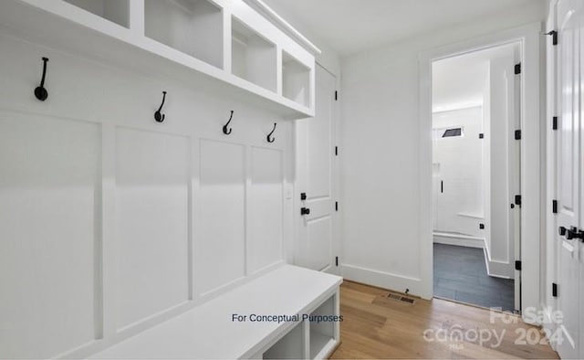 mudroom with light hardwood / wood-style flooring