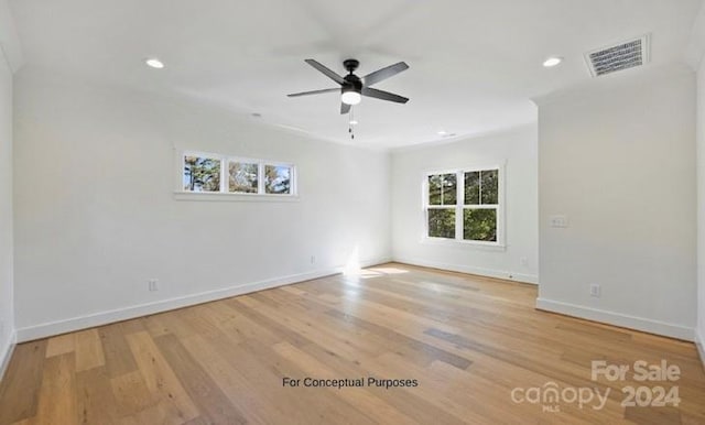 empty room with light hardwood / wood-style floors and ceiling fan