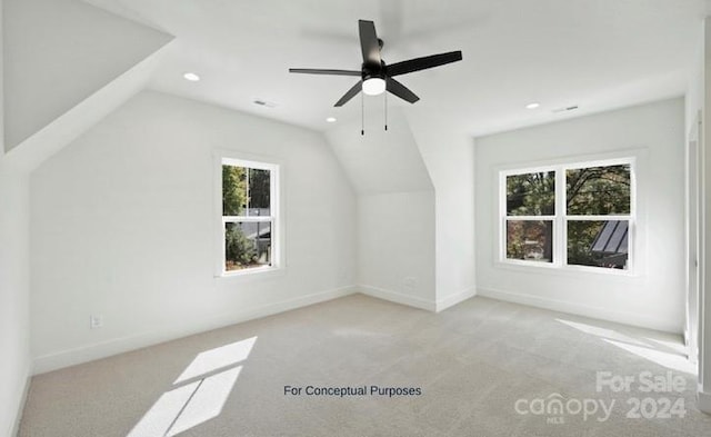 bonus room featuring light carpet, plenty of natural light, and lofted ceiling