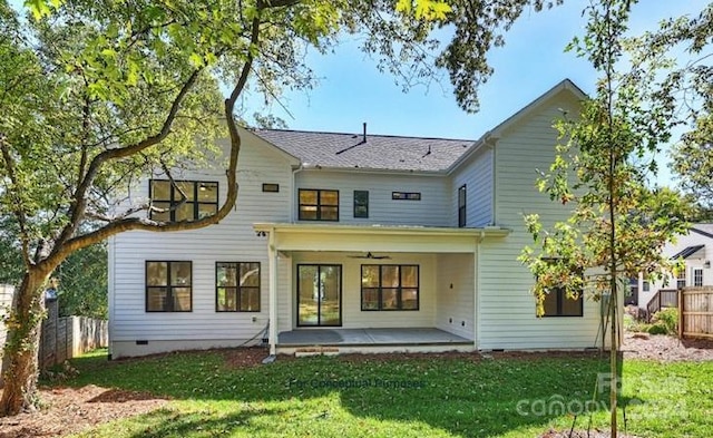 back of house with a yard, ceiling fan, and a patio area