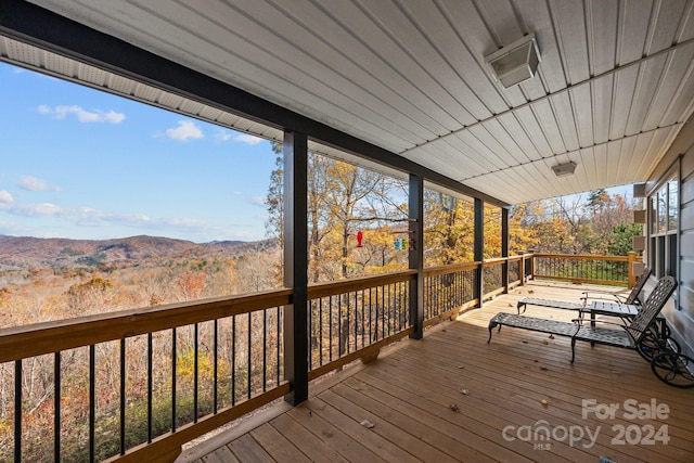 wooden terrace with a mountain view