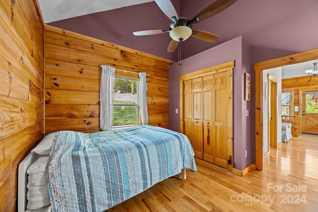 bedroom with light hardwood / wood-style flooring, multiple windows, and ceiling fan