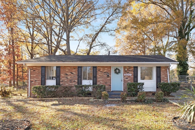 ranch-style home with a front lawn