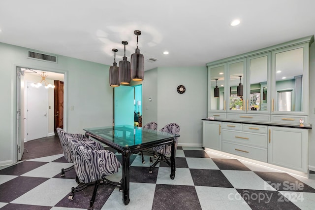 dining space with a notable chandelier