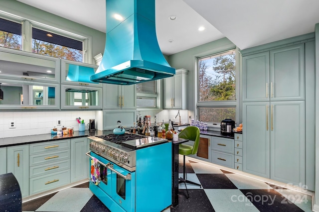 kitchen with island exhaust hood, a kitchen bar, backsplash, and double oven range