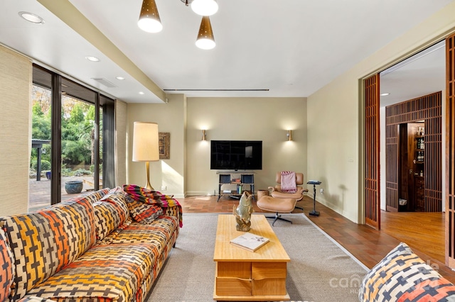 living room with light hardwood / wood-style floors and ceiling fan