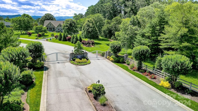 birds eye view of property with a mountain view