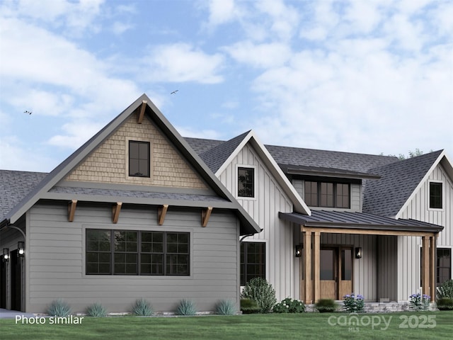 view of front of house featuring metal roof, a shingled roof, board and batten siding, a front lawn, and a standing seam roof