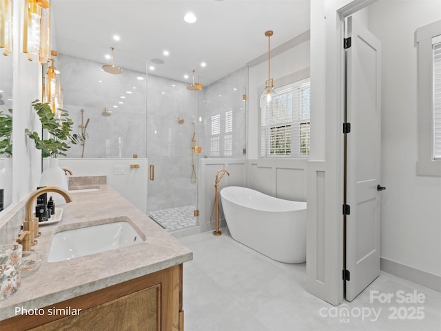 full bathroom featuring double vanity, a soaking tub, a sink, and a shower stall