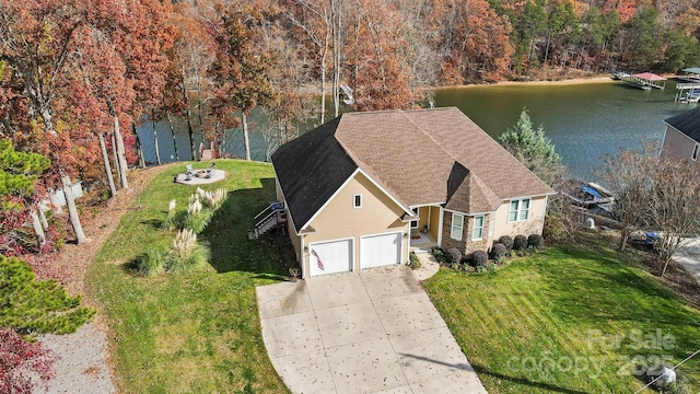 birds eye view of property with a water view