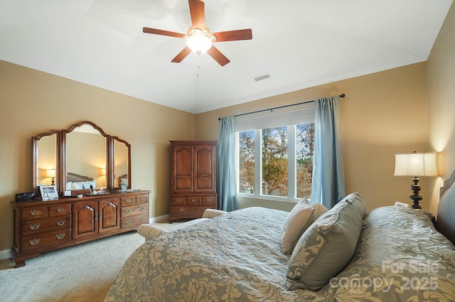 bedroom featuring light carpet and ceiling fan