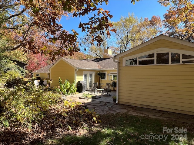 back of house featuring a patio