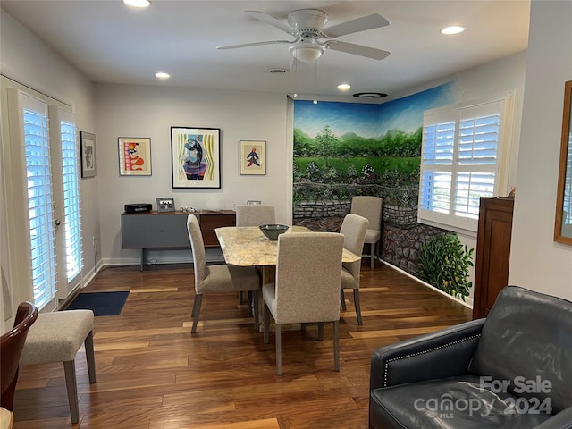 dining space featuring ceiling fan and dark hardwood / wood-style flooring