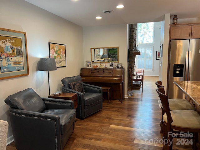 living area with dark hardwood / wood-style floors