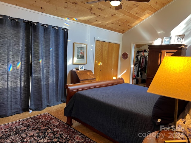 bedroom featuring wooden ceiling, lofted ceiling, carpet flooring, ceiling fan, and a closet