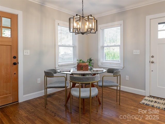 dining area featuring crown molding, plenty of natural light, and dark hardwood / wood-style floors