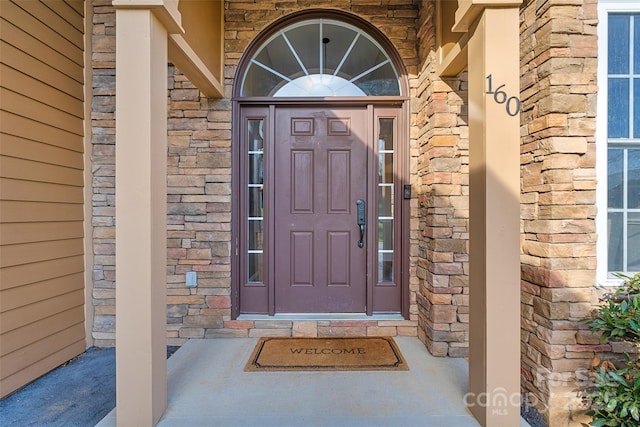 view of exterior entry with stone siding