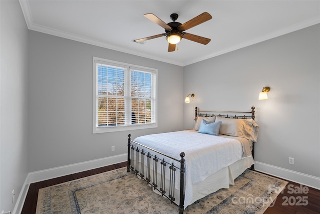 bedroom with baseboards and wood finished floors