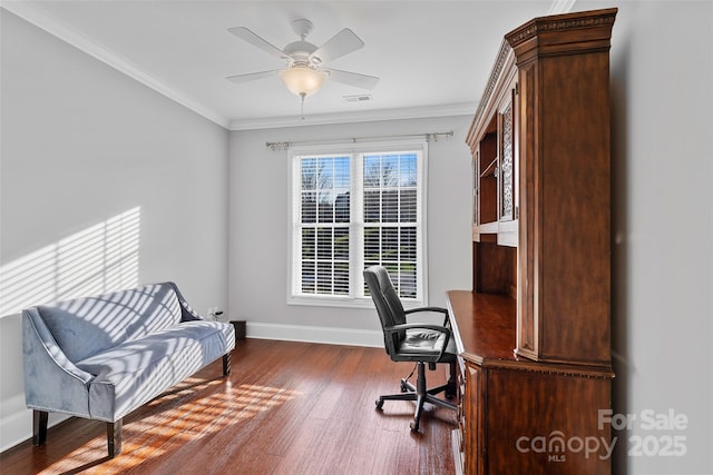 office space with baseboards, ceiling fan, wood finished floors, and crown molding