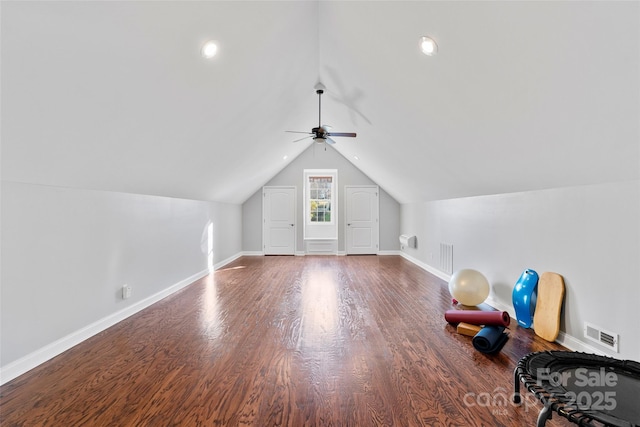 additional living space featuring lofted ceiling, wood finished floors, visible vents, and baseboards